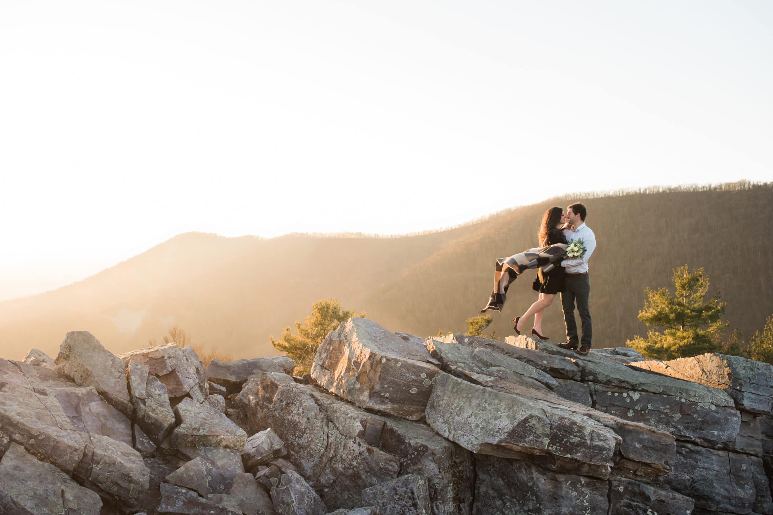 Couple taking engagement photo in Virginia Blue Ridge mountains.