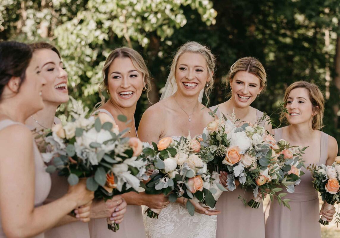 bride with bridesmaids closeup, laughing