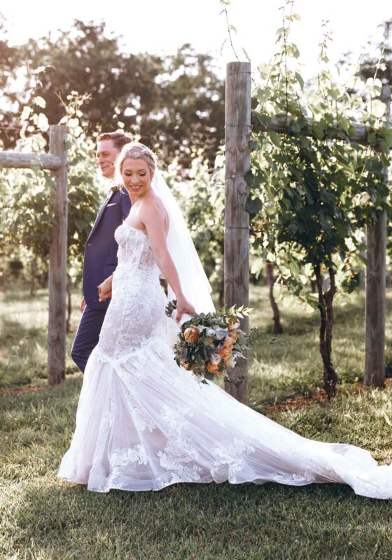 Wes Tessa Lovingston Winery wedding couple in vineyard
