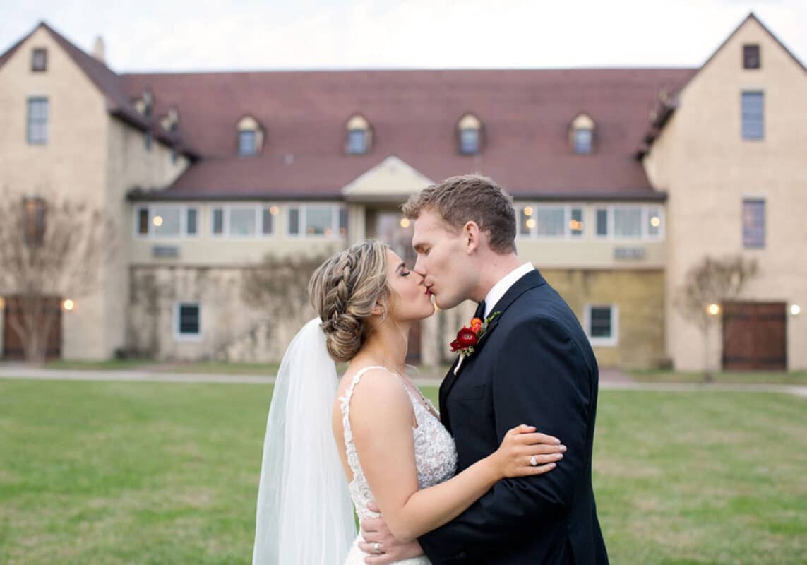 Bride and groom kiss at Williamsburg Winery