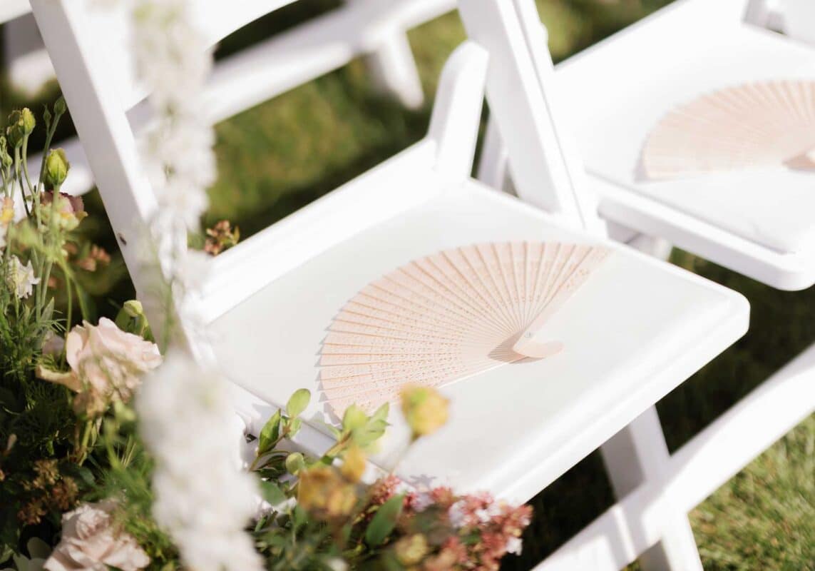 Pretty fans on chairs at Pippin Hill Farm & Winery wedding near Charlottesville VA