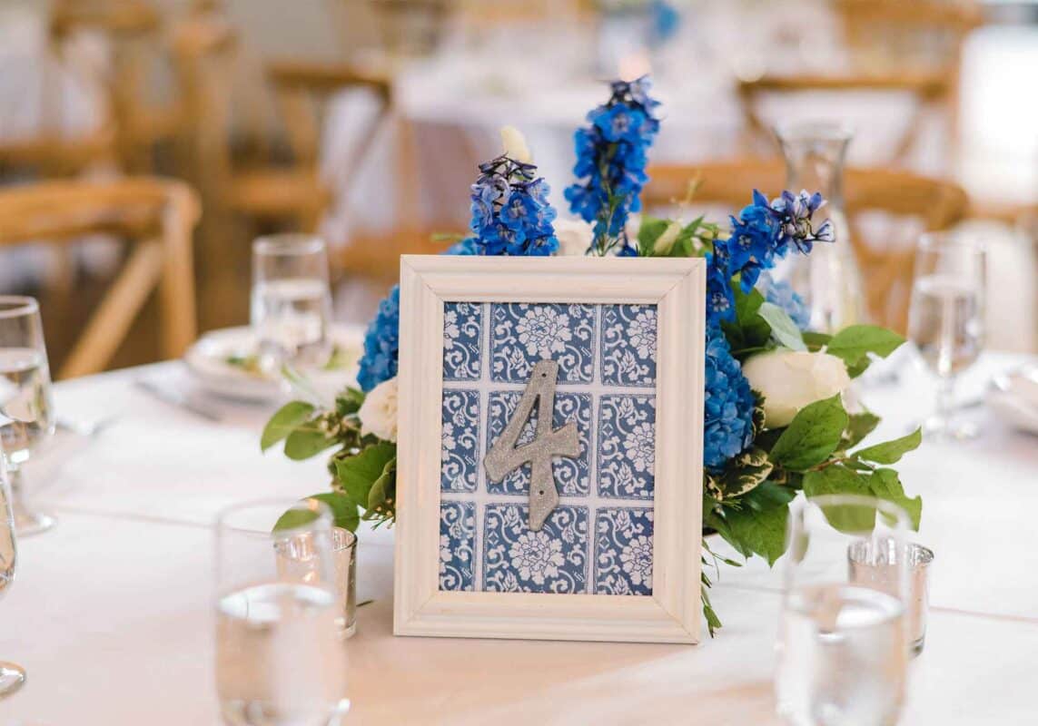 Blue & white floral patterned backgrounds make a trendy place setting for a wedding table.