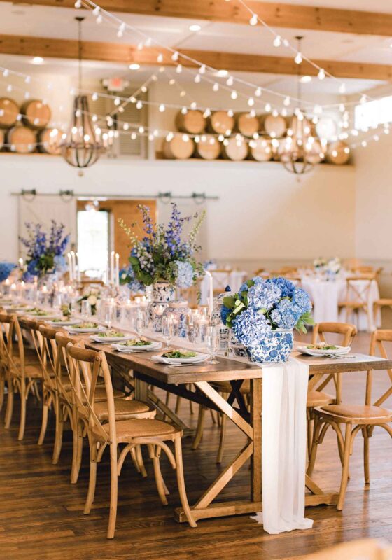 Blue and white florals in chinoiserie vases made an elegant tablescape at this vineyard wedding.