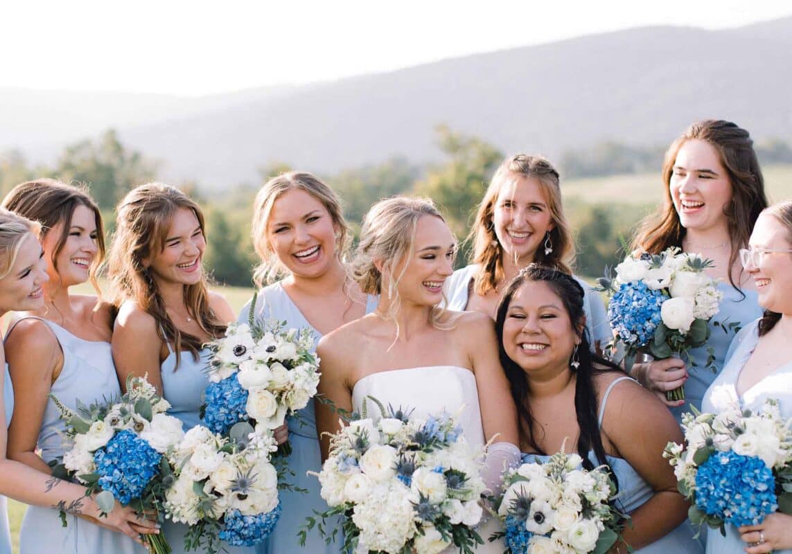 The bridesmaids at this blue & white winery wedding in Virginia wore pale blue to match the florals and decor.