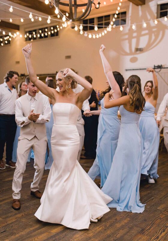 Bridesmaids wore blue to complement the blue & white florals at this Virginia vineyard wedding.