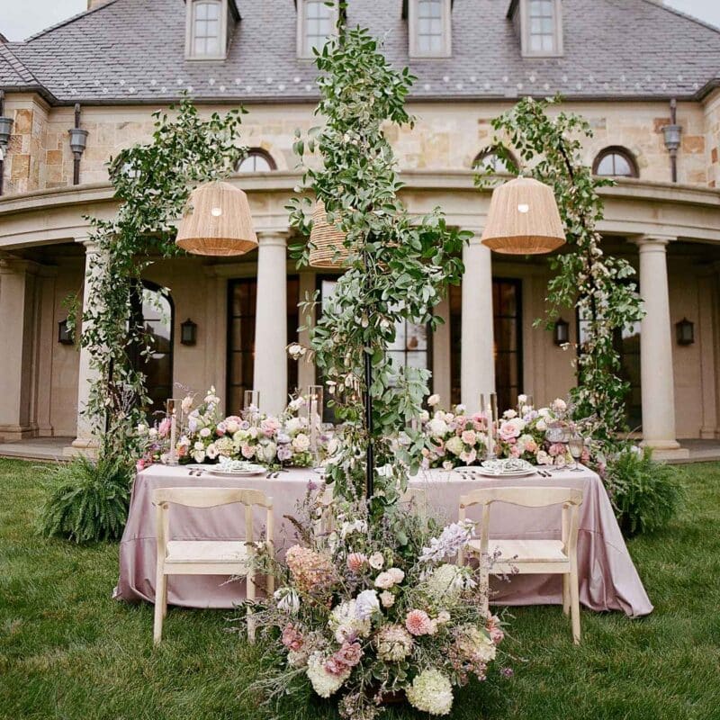 Bramblewood Estate in Virginia Wine Country. Wedding table set with lush florals and hanging basket lamps