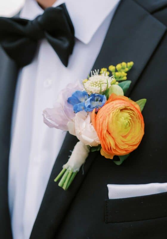 floral wedding at stone tower winery, northern virginia, winery wedding, colorful boutonierre
