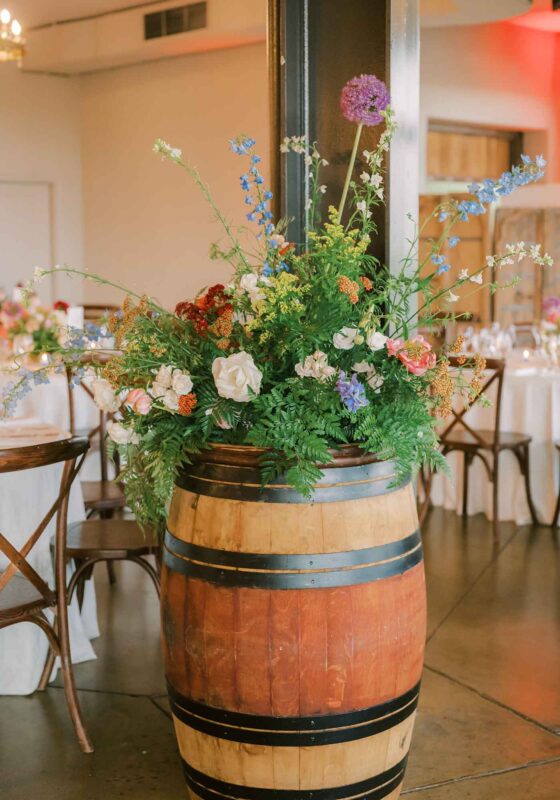 Stone Tower Winery wedding, soft florals and purple alliums in wine barrel